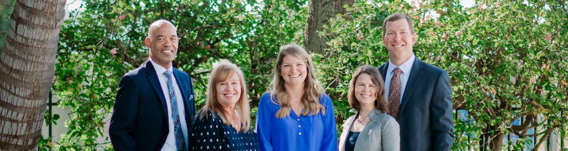 Melville Wealth Management Group photo with trees in background